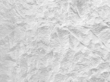 Beyaz taş dokusunun beyaz yüzeyi pürüzlü, gri tonda. Duvar kağıdı ya da arkaplan resmi için bunu kullanın. Metin için boş bir boşluk var.