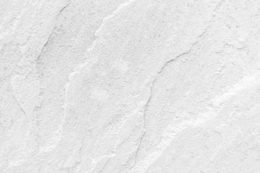 Beyaz taş dokusunun beyaz yüzeyi pürüzlü, gri tonda. Duvar kağıdı ya da arkaplan resmi için bunu kullanın. Metin için boş bir boşluk var.
