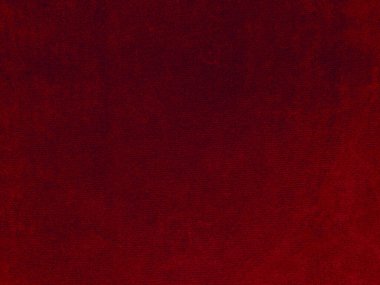 Arka plan olarak kırmızı kadife kumaş dokusu kullanılıyor. Yumuşak ve pürüzsüz tekstil malzemelerinin boş kırmızı kumaş arka planı. Metin için boşluk var.