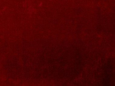 Arka plan olarak kırmızı kadife kumaş dokusu kullanılıyor. Yumuşak ve pürüzsüz tekstil malzemelerinin boş kırmızı kumaş arka planı. Metin için boşluk var.