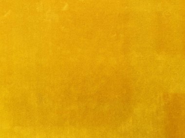 Yellow velvet fabric texture used as background. Empty yellow fabric background of soft and smooth textile material. There is space for text..	