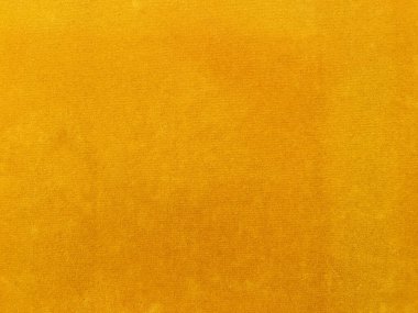 Yellow velvet fabric texture used as background. Empty yellow fabric background of soft and smooth textile material. There is space for text..	