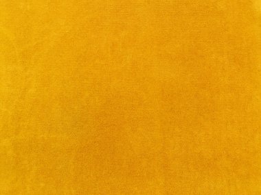 Yellow velvet fabric texture used as background. Empty yellow fabric background of soft and smooth textile material. There is space for text..	