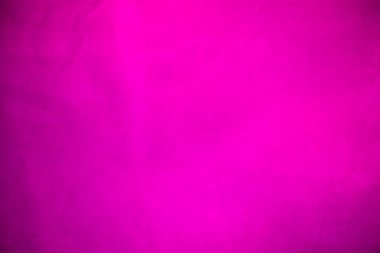 Arkaplan olarak kullanılan kadife kadife kumaş. Yumuşak ve pürüzsüz tekstil malzemelerinin boş pembe kumaş arka planı. Metin için boşluk var..