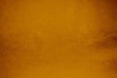 Arka plan olarak turuncu kadife kumaş dokusu kullanılır. Yumuşak ve pürüzsüz tekstil malzemesinin turuncu renkli panne kumaş arka planı. Ezilmiş kadife. İpek gradyan için turuncu renkli..