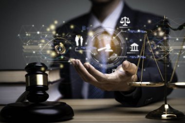 Lawyer's hand concept Justice with Judge gavel, Businessman in suit or Hiring lawyers in the digital system. Legal law, prosecution, legal adviser, lawsuit, detective, investigation,legal consultant.	
