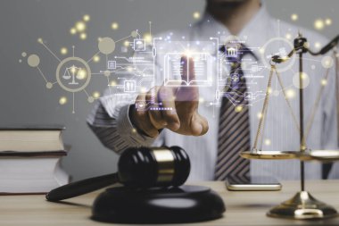Lawyer's hand concept Justice with Judge gavel, Businessman in suit or Hiring lawyers in the digital system. Legal law, prosecution, legal adviser, lawsuit, detective, investigation,legal consultant.	