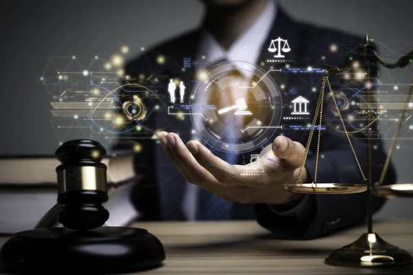 Lawyer's hand concept Justice with Judge gavel, Businessman in suit or Hiring lawyers in the digital system. Legal law, prosecution, legal adviser, lawsuit, detective, investigation,legal consultant.	