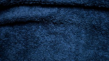 Dark blue velvet fabric texture used as background. Sky color panne fabric background of soft and smooth textile material. crushed velvet .luxury cobalt tone for silk.	
