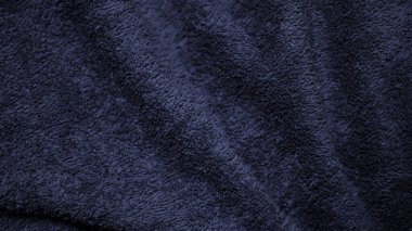 Dark blue velvet fabric texture used as background. Sky color panne fabric background of soft and smooth textile material. crushed velvet .luxury cobalt tone for silk.	