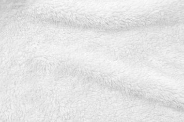 White clean wool texture background. light natural sheep wool. white seamless cotton. texture of fluffy fur for designers. close-up fragment white wool carpet.	