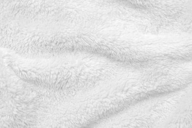 White clean wool texture background. light natural sheep wool. white seamless cotton. texture of fluffy fur for designers. close-up fragment white wool carpet.	