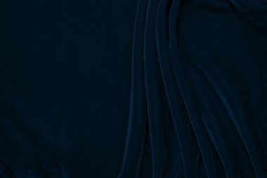 Gradient Dark blue velvet fabric texture used as background. navy color fabric background of soft and smooth textile material. crushed velvet .luxury blue tone for silk.	