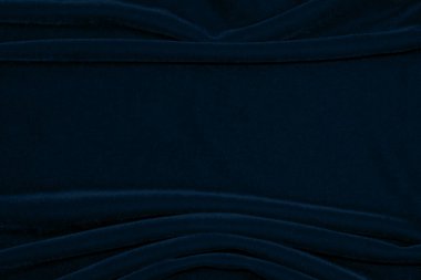 Gradient Dark blue velvet fabric texture used as background. navy color fabric background of soft and smooth textile material. crushed velvet .luxury blue tone for silk.	