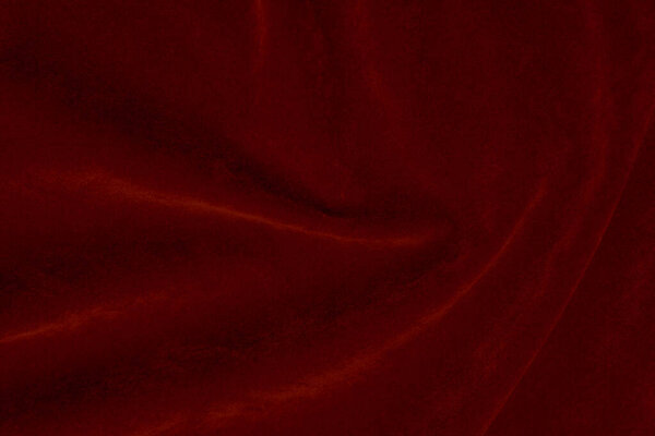 Red silk fabric texture used as background. red panne fabric background of soft and smooth textile material. crushed velvet .luxury scarlet for velvet..	