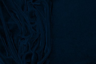 light blue corduroy fabric texture used as background. color blue fabric background of soft and smooth textile material. cloth, velvet, grooves luxury navy tone for silk.	