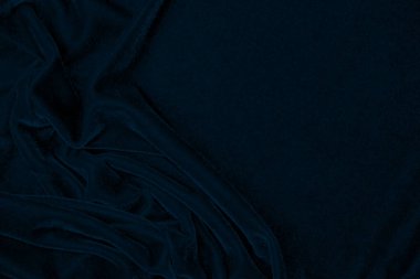 light blue corduroy fabric texture used as background. color blue fabric background of soft and smooth textile material. cloth, velvet, grooves luxury navy tone for silk.	