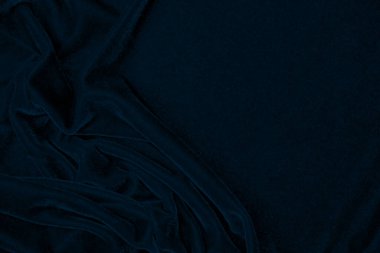 light blue corduroy fabric texture used as background. color blue fabric background of soft and smooth textile material. cloth, velvet, grooves luxury navy tone for silk.	