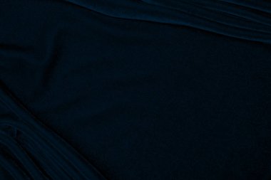light blue corduroy fabric texture used as background. color blue fabric background of soft and smooth textile material. cloth, velvet, grooves luxury navy tone for silk.	