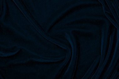 light blue corduroy fabric texture used as background. color blue fabric background of soft and smooth textile material. cloth, velvet, grooves luxury navy tone for silk.	