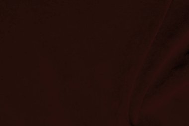 Arka plan olarak kullanılan koyu kırmızı kadife kumaş dokusu. Yumuşak ve pürüzsüz tekstil malzemelerinin ipek rengi kırmızı kumaş arka planı. Ezilmiş kadife. İpek için lüks koyu renk..