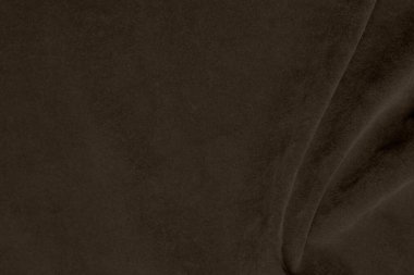 Arka plan olarak kullanılan ipek kahverengi kadife kumaş dokusu. Yumuşak ve pürüzsüz tekstil malzemelerinden oluşan boş kahverengi kumaş. Metin için boşluk var.