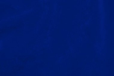 Arka plan olarak kullanılan açık mavi kadife kumaş dokusu. Yumuşak ve pürüzsüz tekstil malzemelerinin ipek renkli kumaş arka planı. Ezilmiş kadife. Lüks deniz mavisi. İpek için açık renk..