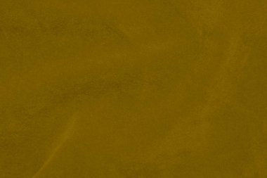 Arka plan olarak kullanılan açık sarı kadife kumaş dokusu. Yumuşak ve pürüzsüz tekstil malzemelerinin ipek rengi altın kumaş arka planı. Ezilmiş kadife. İpek için lüks altın rengi..