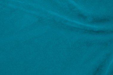 Arka plan olarak Tiffany rengi mavi kadife kumaş dokusu kullanılıyor. Yumuşak ve pürüzsüz tekstil malzemelerinin ipek renkli kumaş arka planı. Ezilmiş kadife. Lüks deniz mavisi. İpek için açık renk..