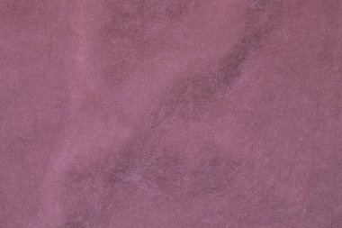 Arka plan olarak kullanılan açık pembe kadife kumaş dokusu. Yumuşak ve pürüzsüz tekstil malzemelerinin ipek rengi Sakura kumaş arka planı. Ezilmiş kadife. Lüks kiraz çiçeği. İpek için hafif ton..