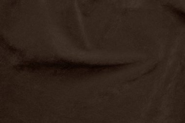 Arka plan olarak kullanılan kahverengi renkli kadife kumaş dokusu. Yumuşak ve pürüzsüz tekstil malzemelerinden oluşan boş kahverengi kumaş. Metin için boşluk var.