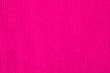 Arka plan olarak kullanılan pembe kadife kumaş dokusu. Yumuşak ve pürüzsüz tekstil malzemelerinden oluşan temiz kumaş. Kumaş, kadife, ipek için sakura tonu..