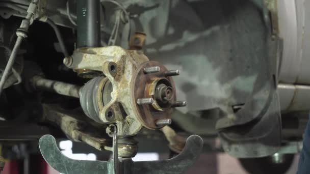 Young Auto Mechanic Repairs Old Car Dismantling Old Parts — Stock Video