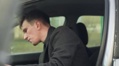 young car driver inspecting his first car. close-up