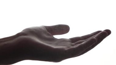 man sprays disinfectant on his palm on a white background. antiseptic. close-up