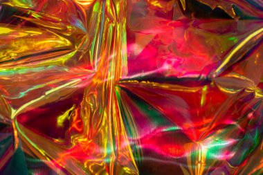 Holographic foil texture. Neon colors. Abstract colorful background