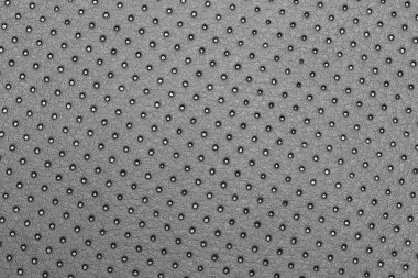 Seamless perforated black leather geometric pattern for background, banner, or cover