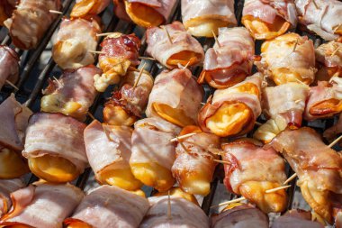 Smoked cheese made of salted sheep milk wrapped in bacon. Regional food product from the Tatra Mountains, Poland