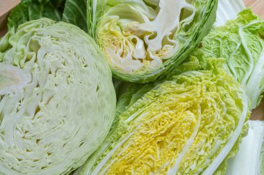 Cabbage halves on the kitchen bamboo table