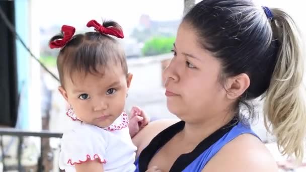 Latina Mother Holding Her Little Baby Girl Her Arms While — Stock videók