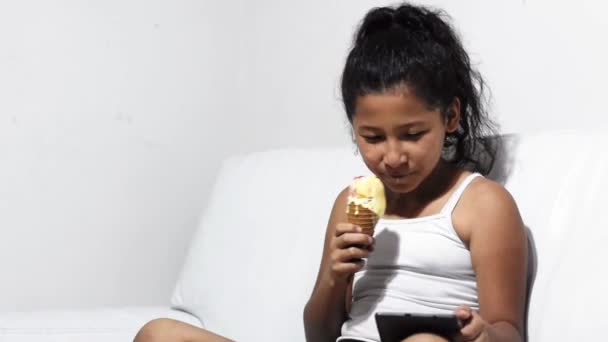 Little Latina Brunette Girl Smiling While Eating Ice Cream Looking — Video