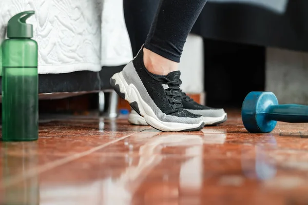 stock image detailed view of the feet of a young latina woman modeling her workout sneakers