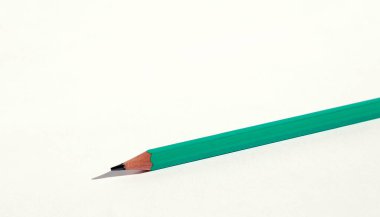 Green pencil with gray lead isolated on white background. Close up
