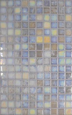 Mosaic texture for apartment decoration. Colored mosaic tiles are laid out on the wall. Wall design concept