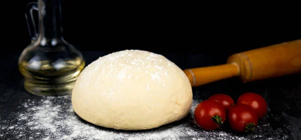 Cooking Pizza Raw Dough Rolling Pin Cherry Tomatoes Black Background — Stock Photo, Image
