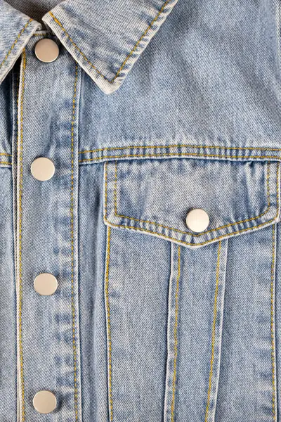 Denim jacket collar and pocket, texture background