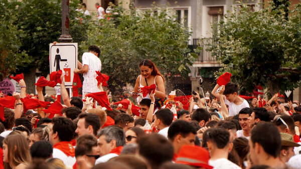    people douse themselves with wine in honor of the opening of the holiday: San Fermin. city : Pamplona (Navarra) Espaa .6 de julio 2023ao                              