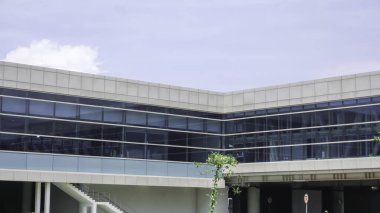 Photo of the sky from inside the building with plants. Airport buildings.