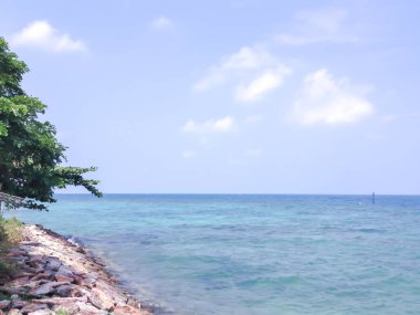 Beautiful seascape with blue sky and white clouds. Natural background.