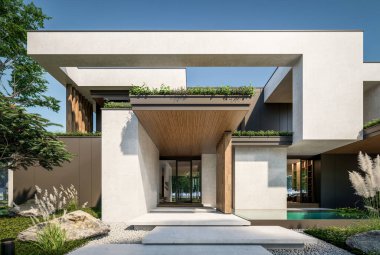 Otoparkı ve havuzu satılık ya da kiralık iki katlı evin beton cepheli ve arka planda güzel bir peyzajı var. Mavi gökyüzü açık güneşli bir yaz günü.